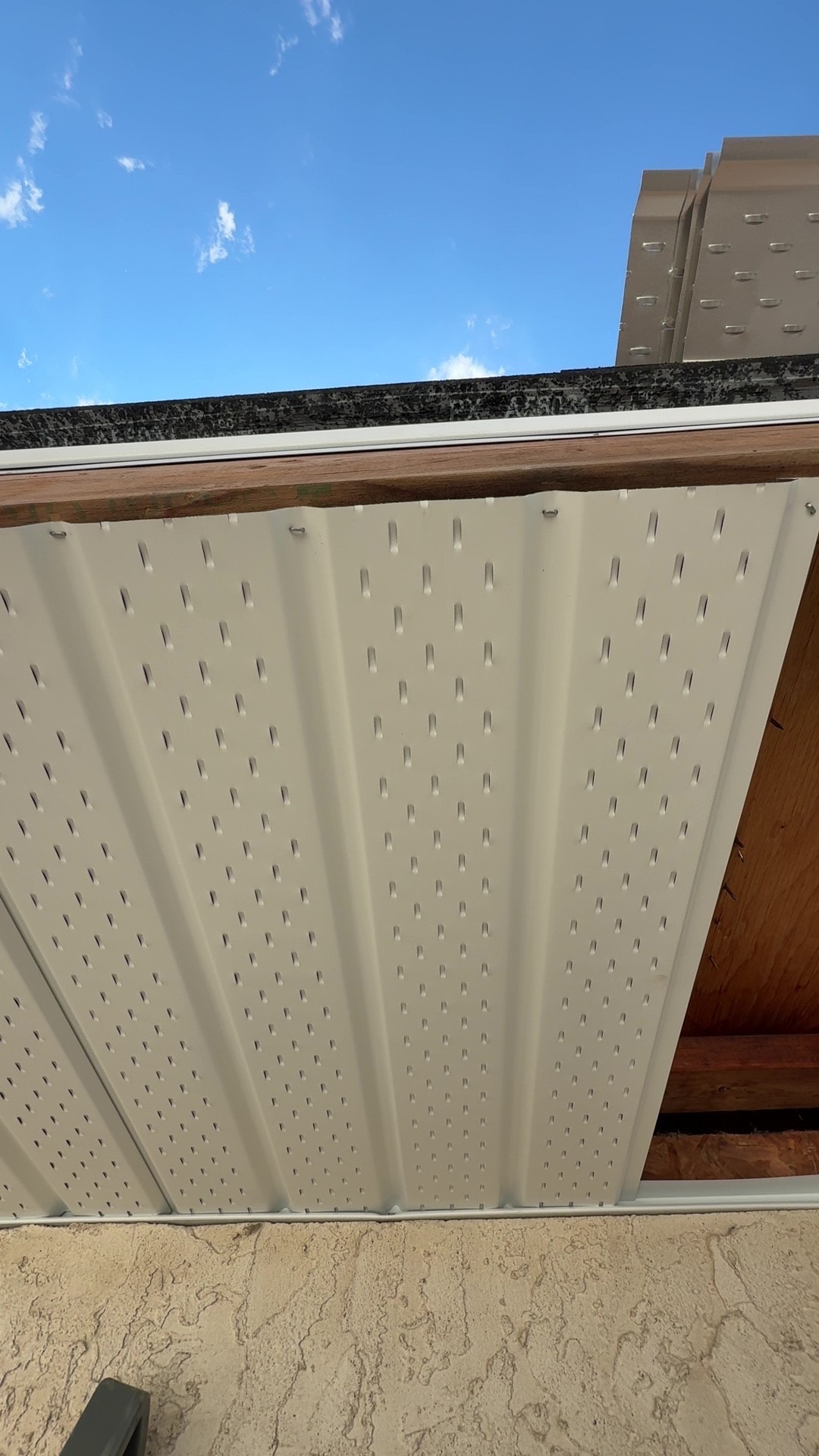 Aluminum soffit installation showing individual stapling and fastening — BWK Exteriors Regina